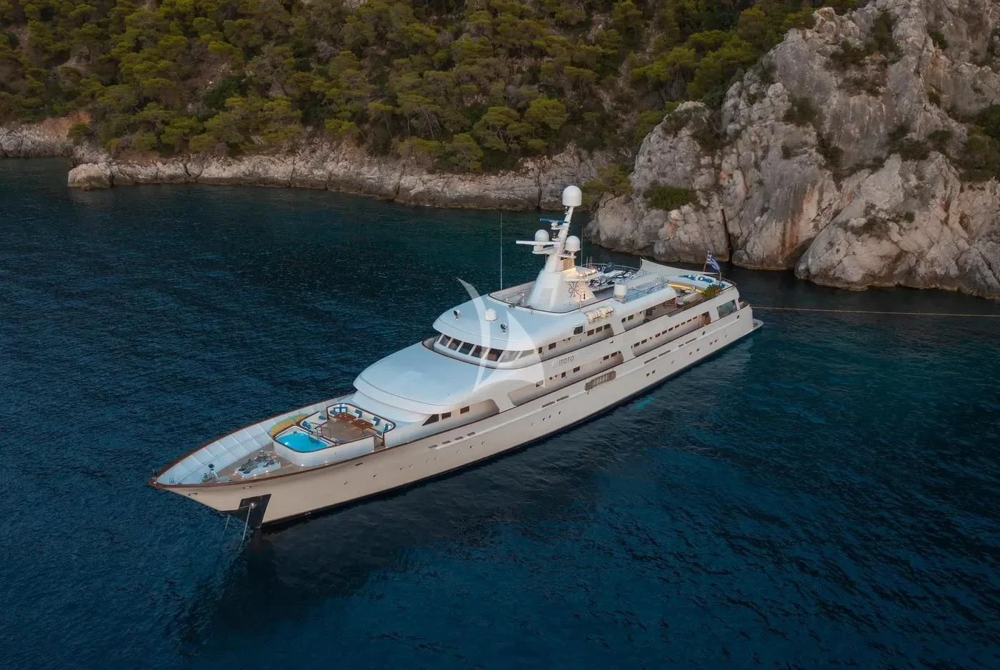 a white boat on water aboard ITOTO Yacht for Charter
