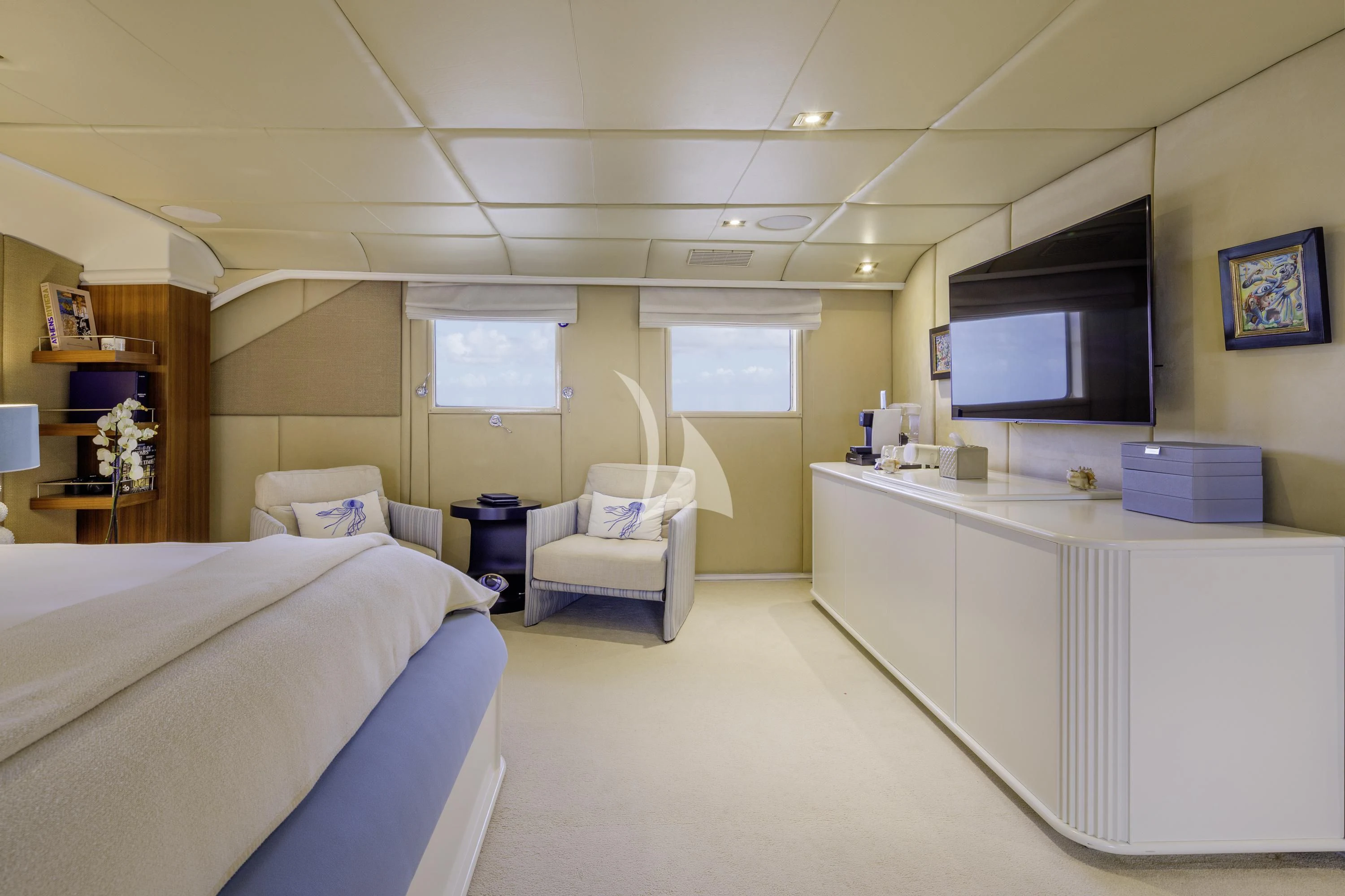a room with a bed and a desk aboard ITOTO Yacht for Charter