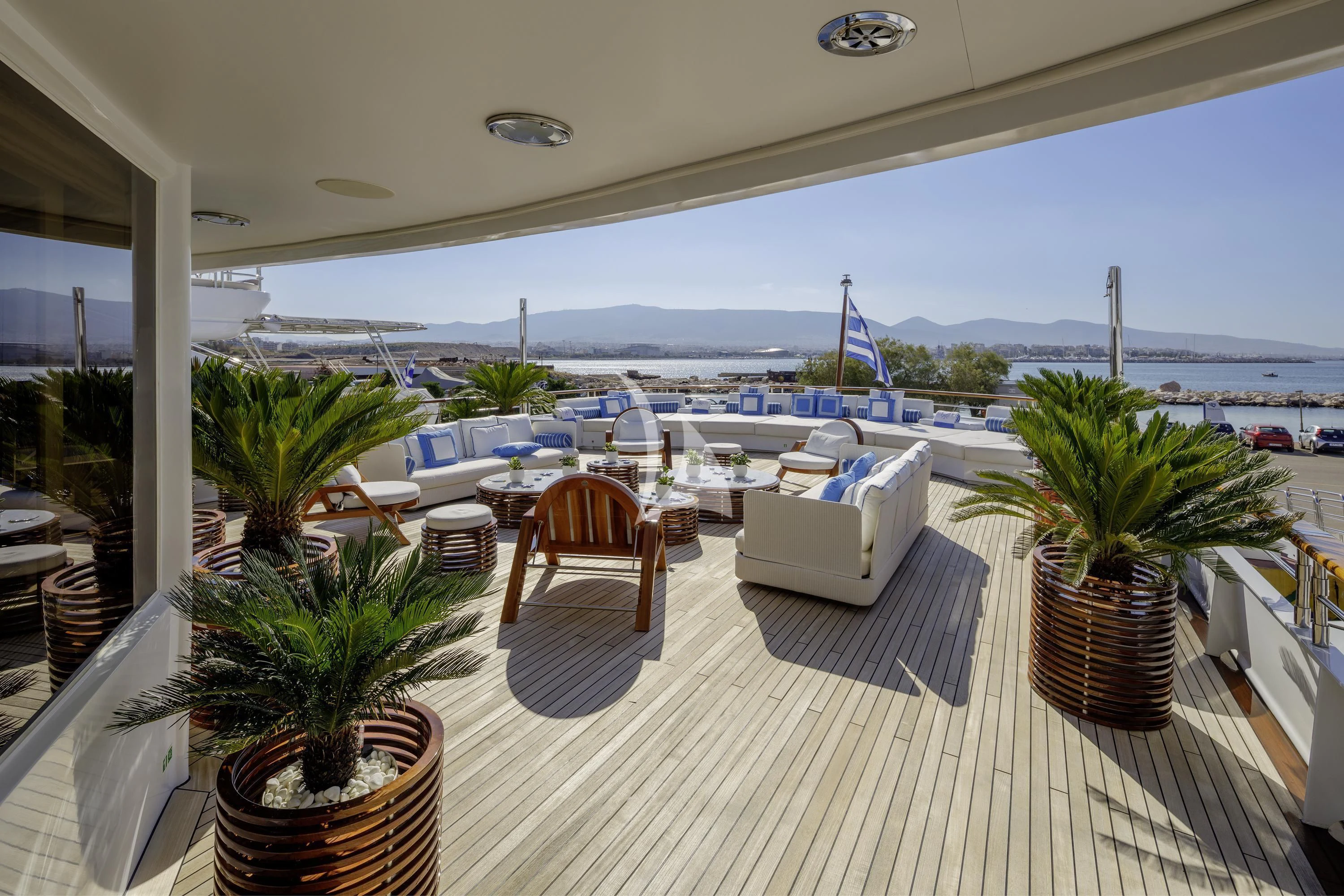 a patio with chairs and tables aboard ITOTO Yacht for Charter