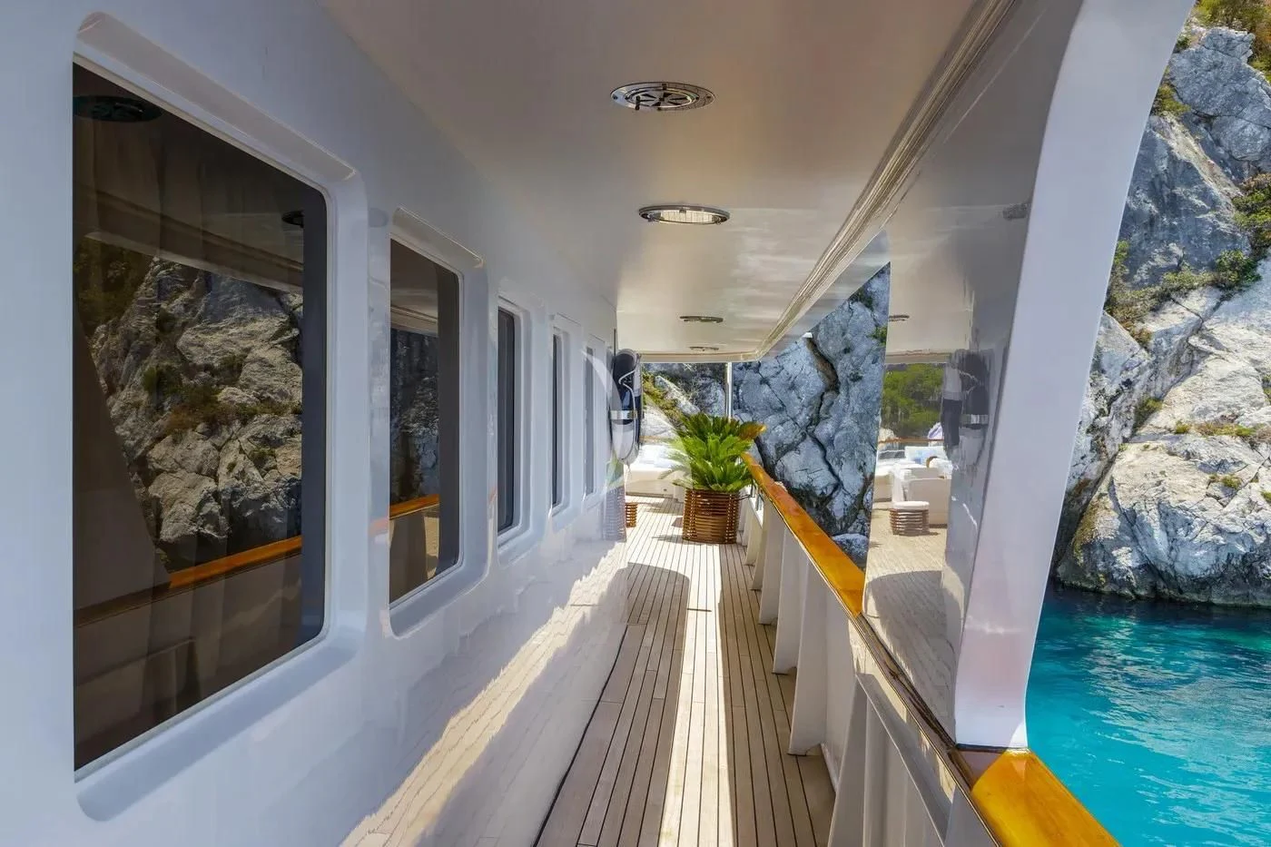 a pool with a deck and a deck aboard ITOTO Yacht for Charter