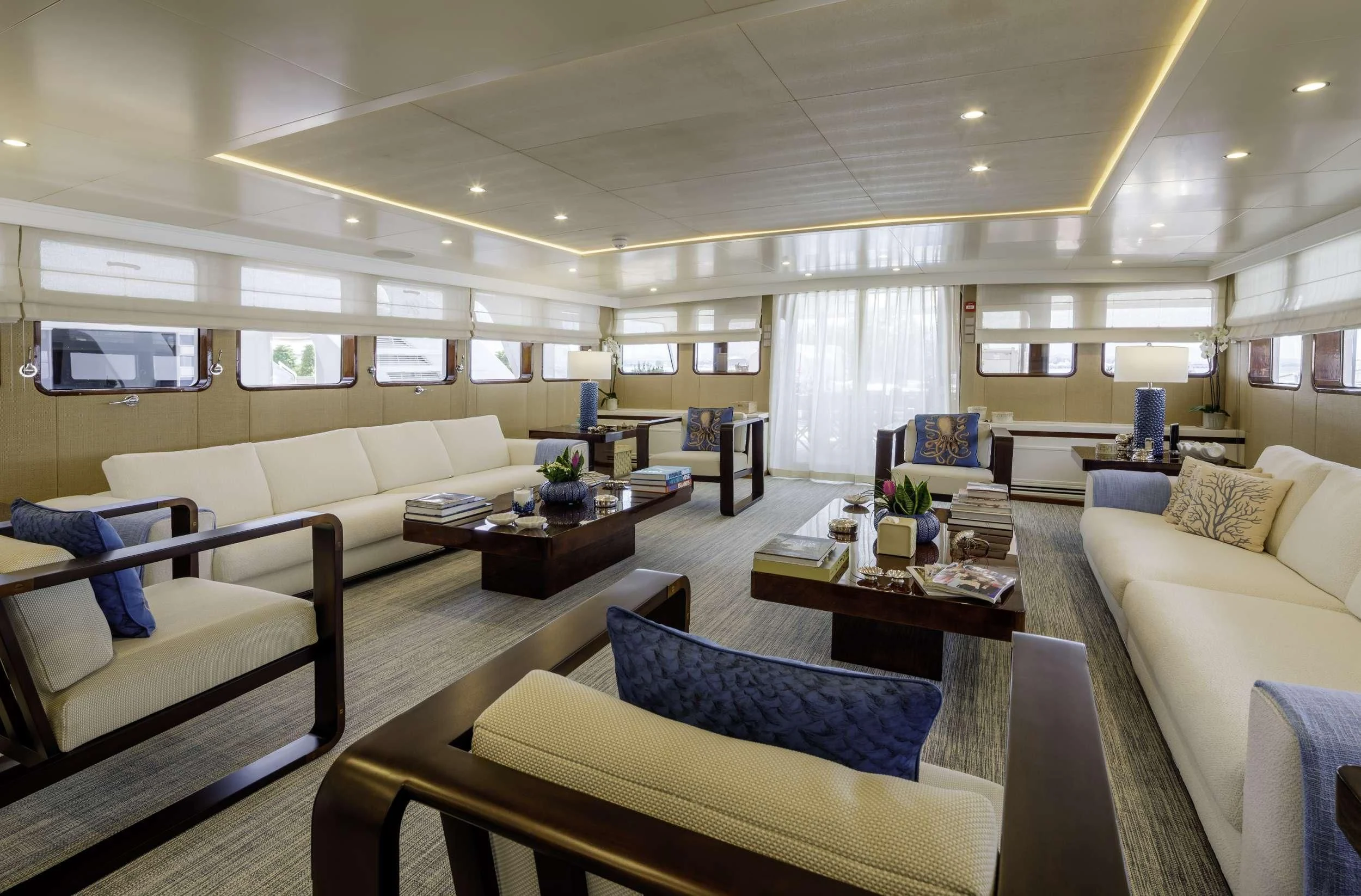 a living room with couches and a coffee table aboard ITOTO Yacht for Charter