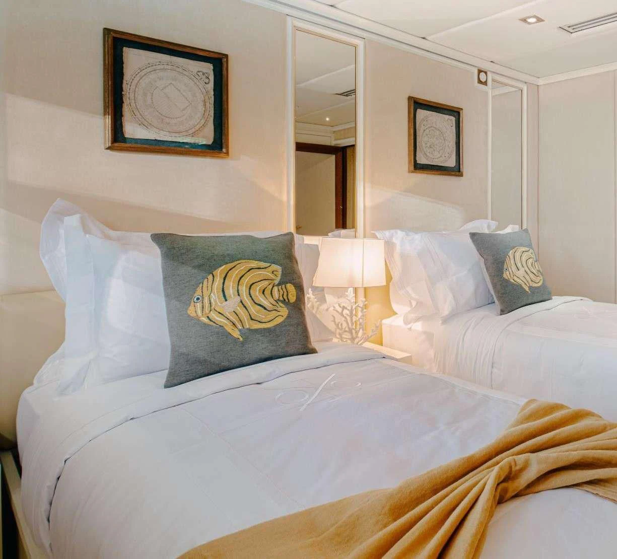 a bed with pillows aboard ITOTO Yacht for Charter