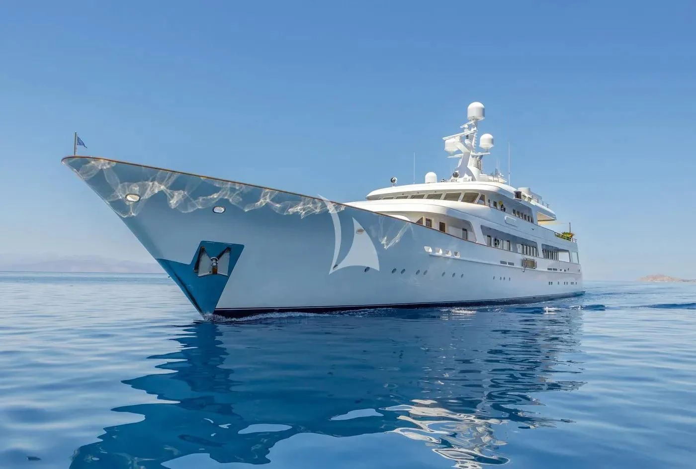 a large white boat in the water aboard ITOTO Yacht for Charter