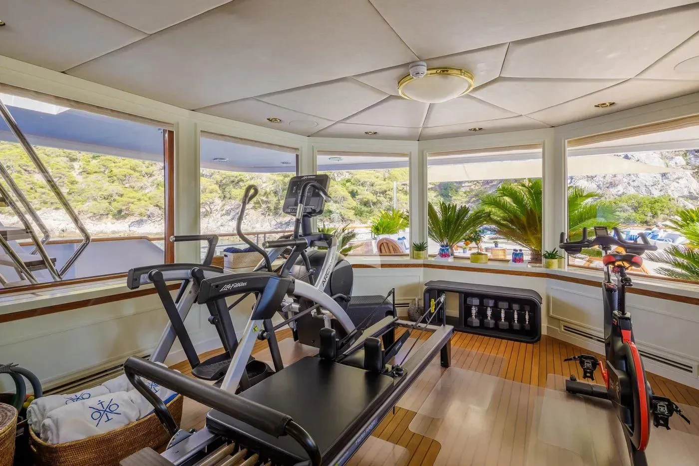 a room with gym equipment aboard ITOTO Yacht for Charter