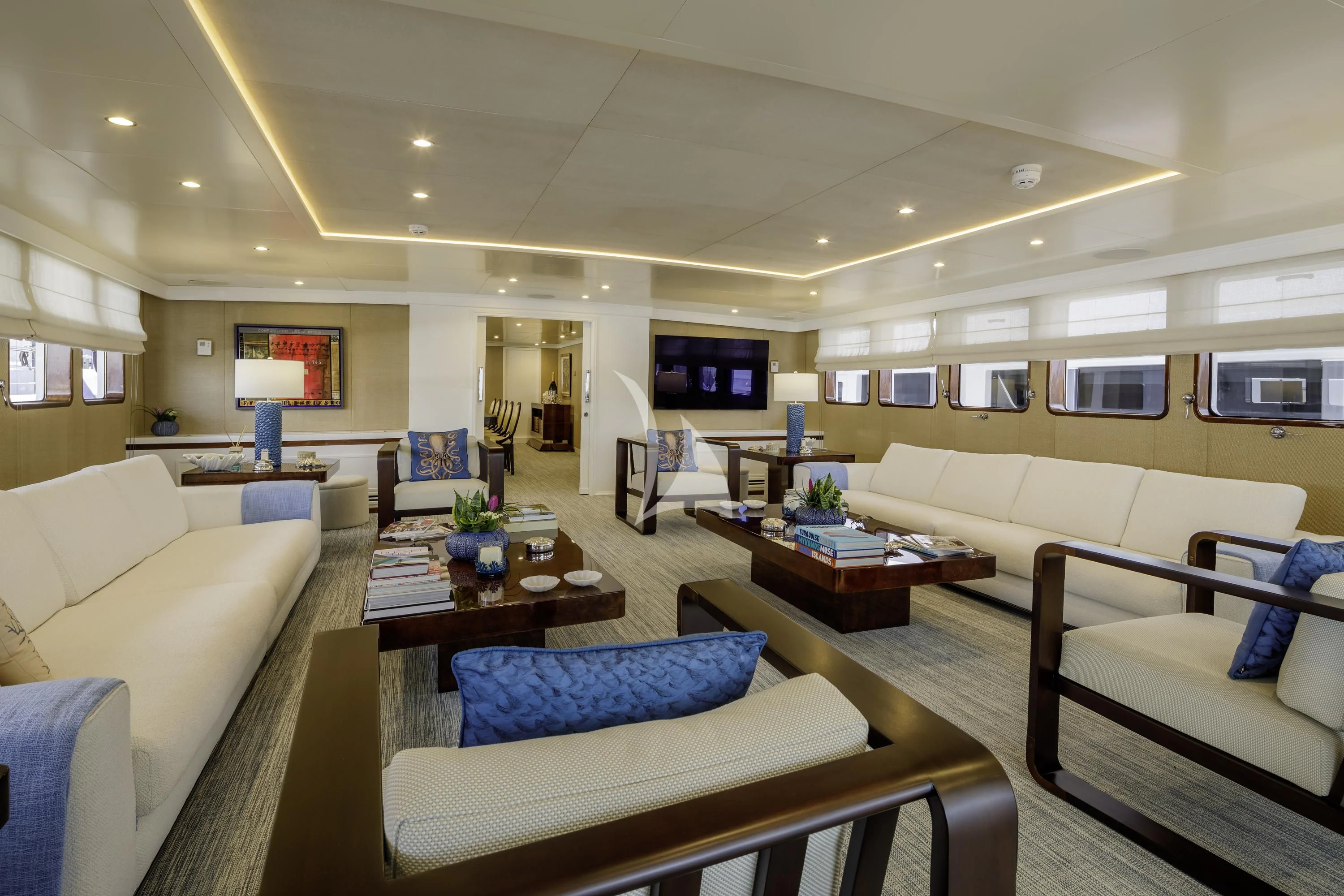 a living room with white couches aboard ITOTO Yacht for Charter