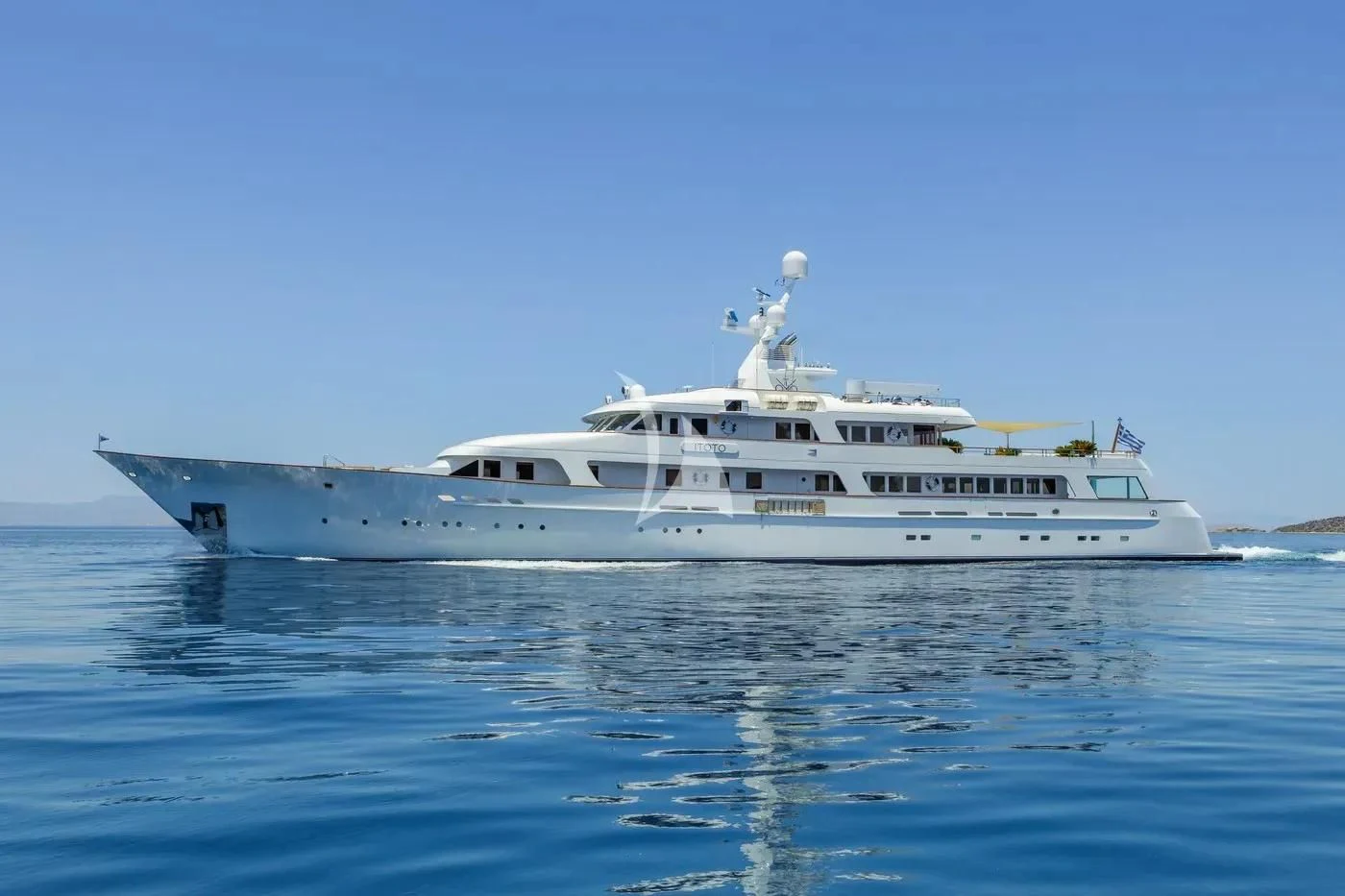 a white yacht in the water aboard ITOTO Yacht for Charter