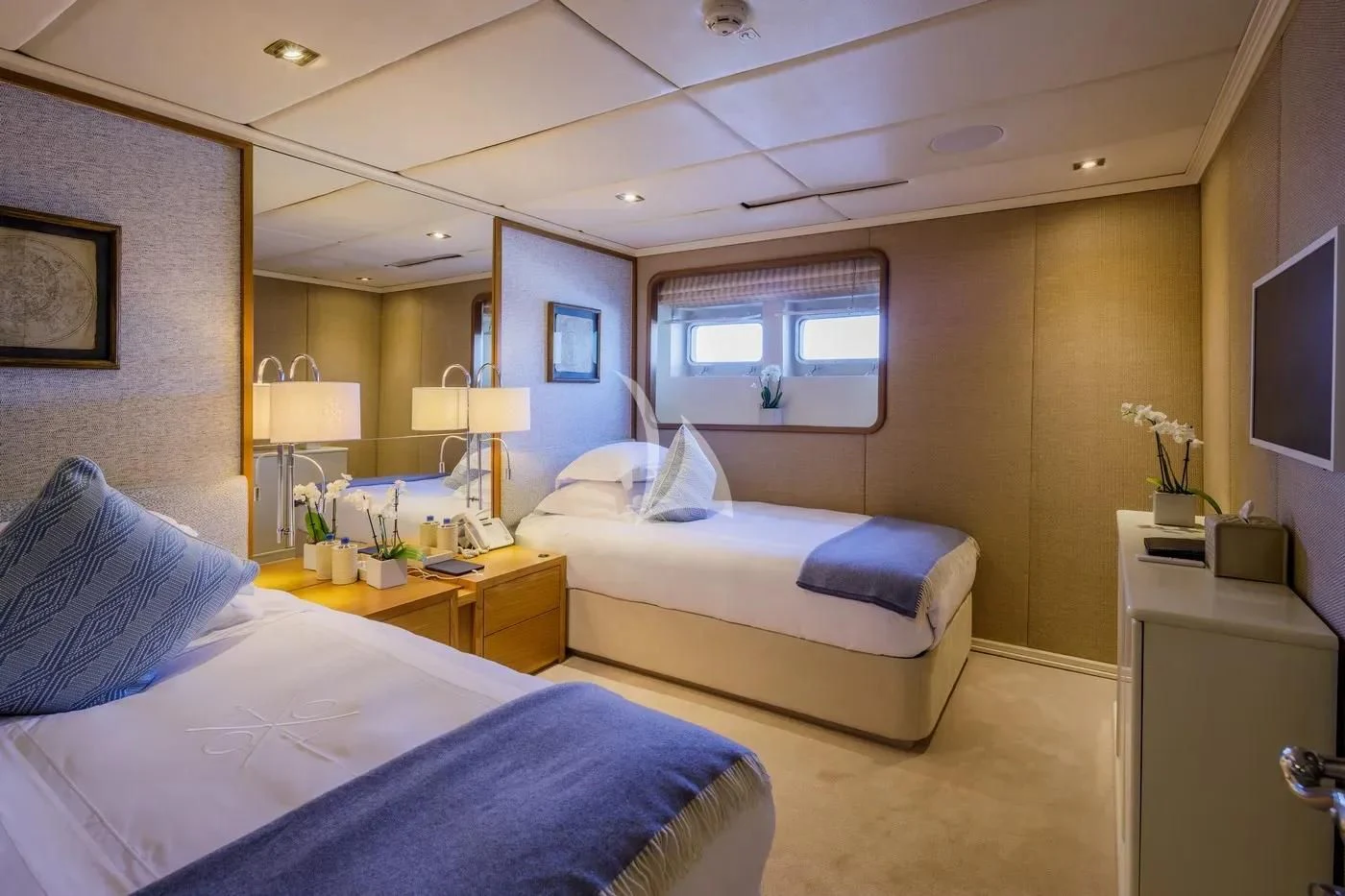 a couple of beds in a hotel room aboard ITOTO Yacht for Charter