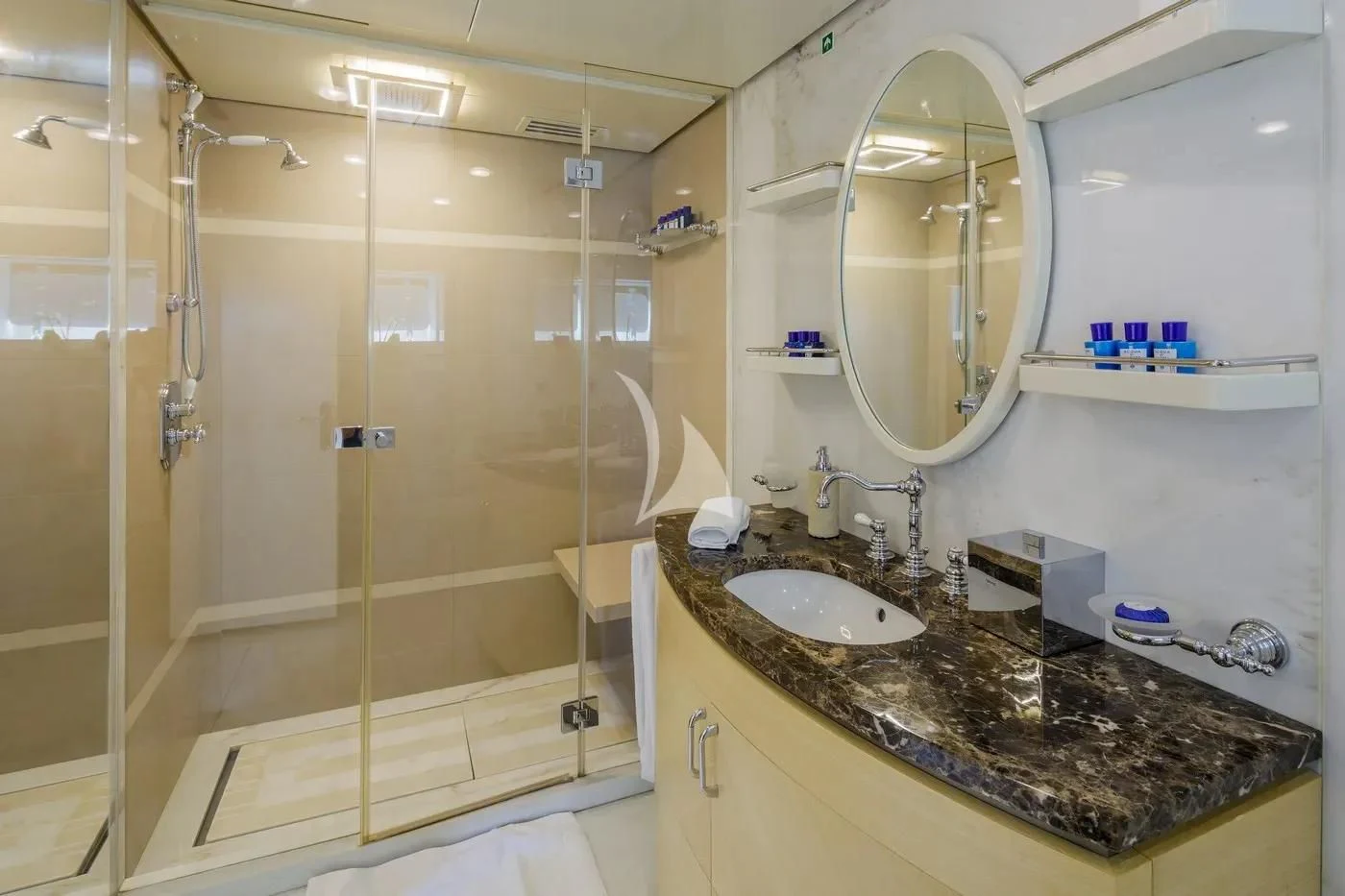 a bathroom with a marble countertop aboard ITOTO Yacht for Charter