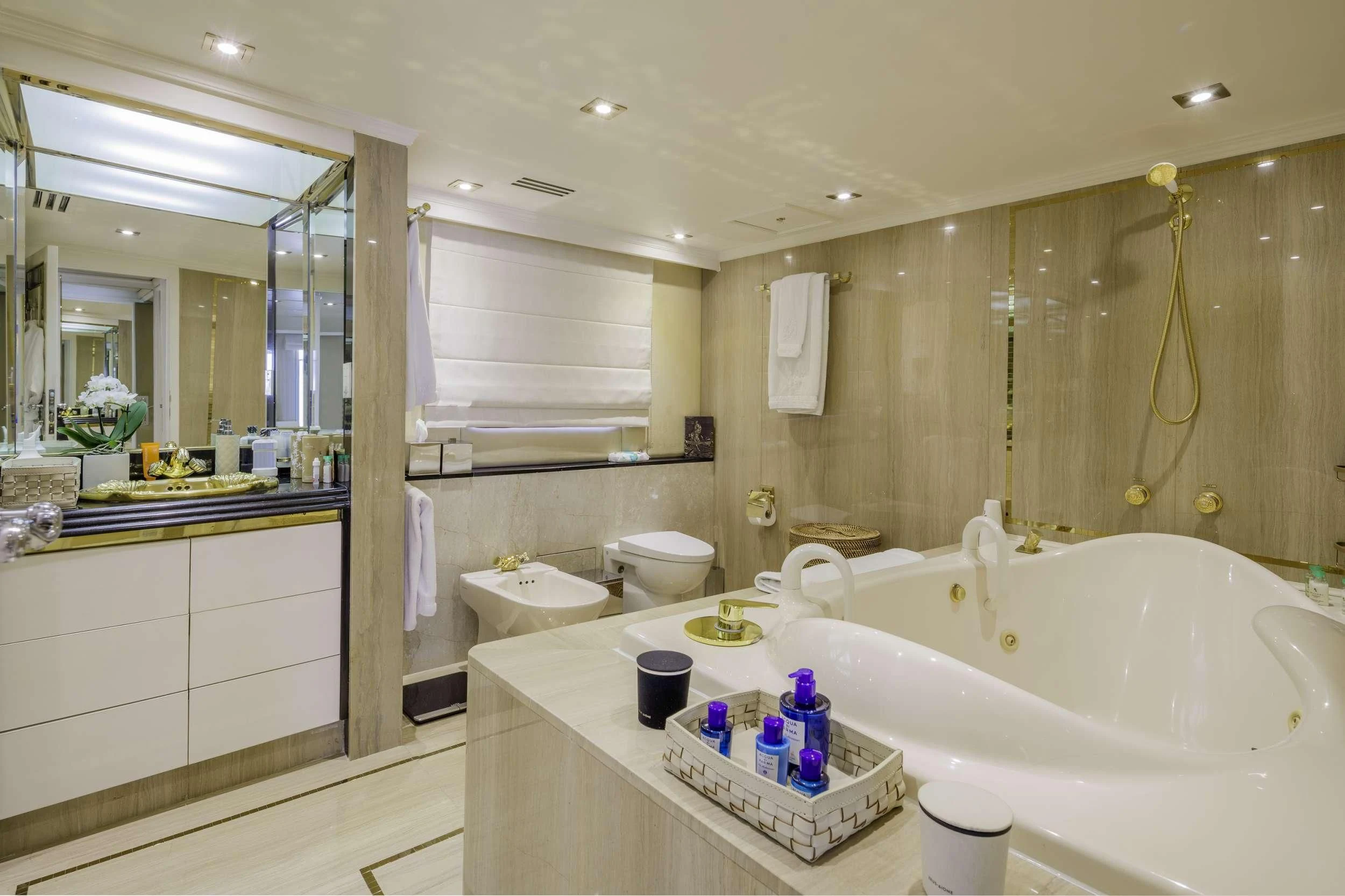 a bathroom with a tub sink and toilet aboard ITOTO Yacht for Charter