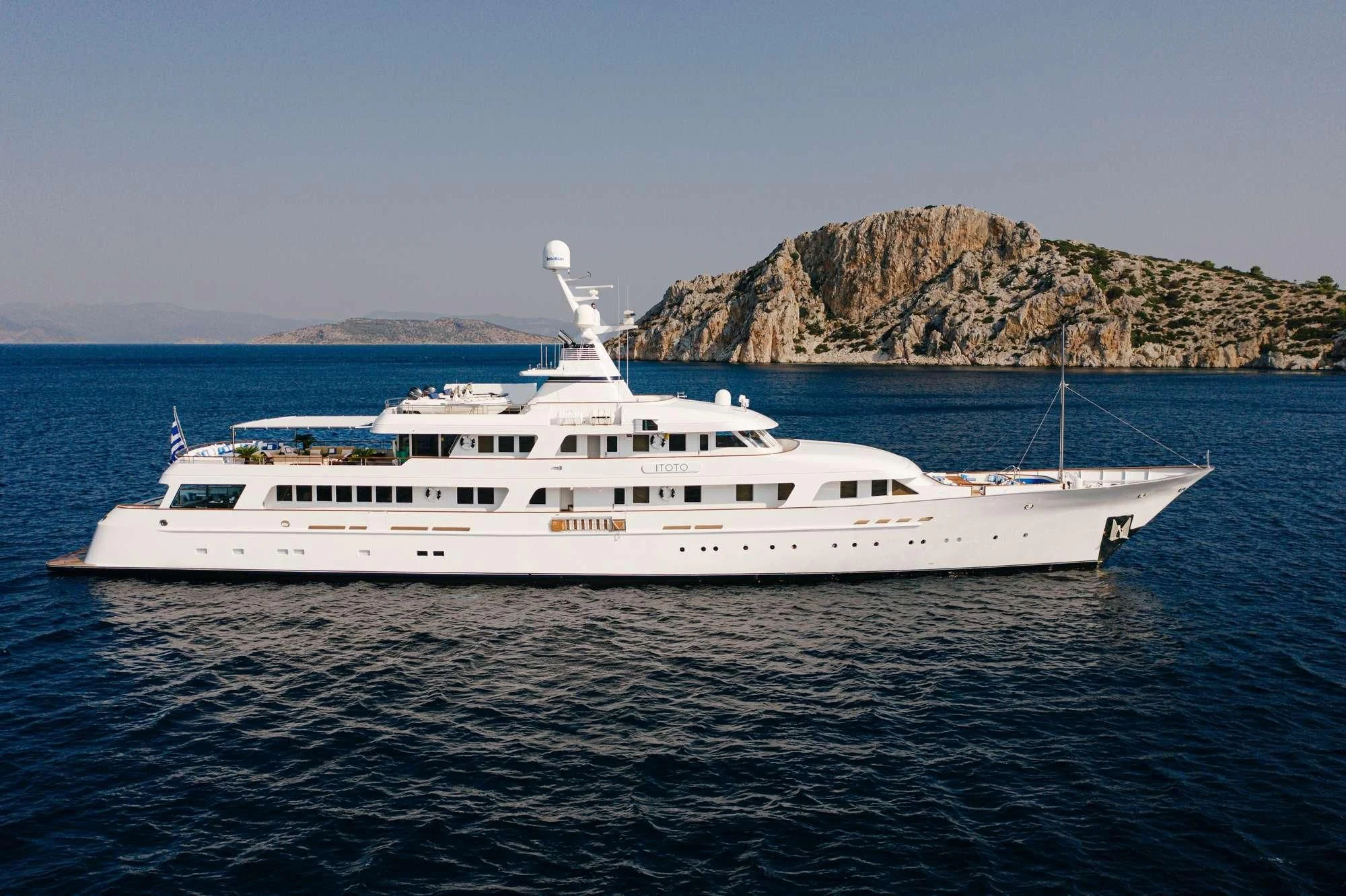 a white yacht in the water aboard ITOTO Yacht for Charter