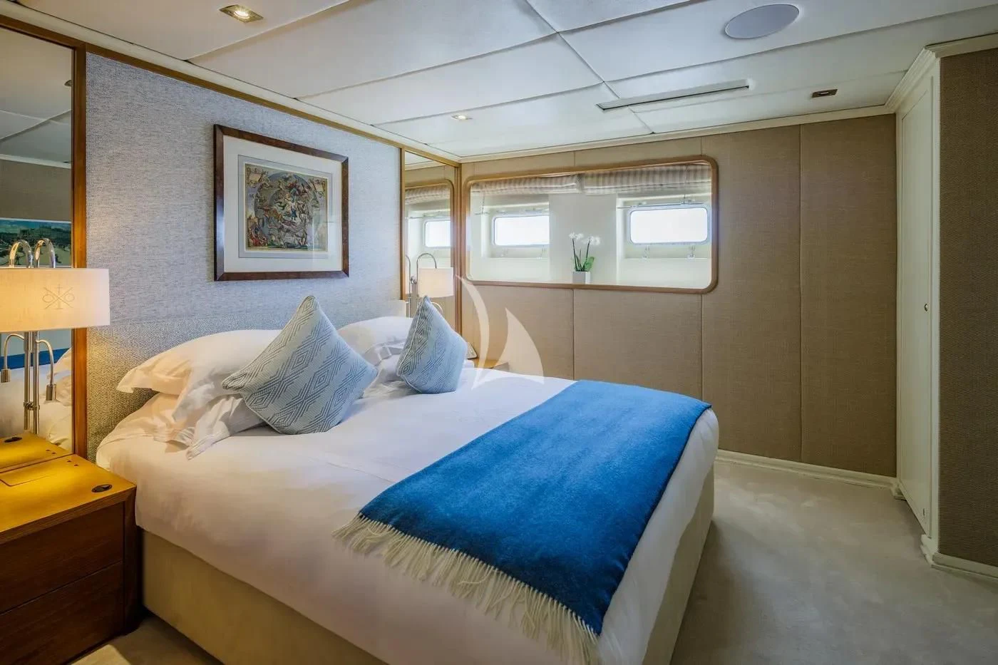 a bedroom with a bed and a desk aboard ITOTO Yacht for Charter