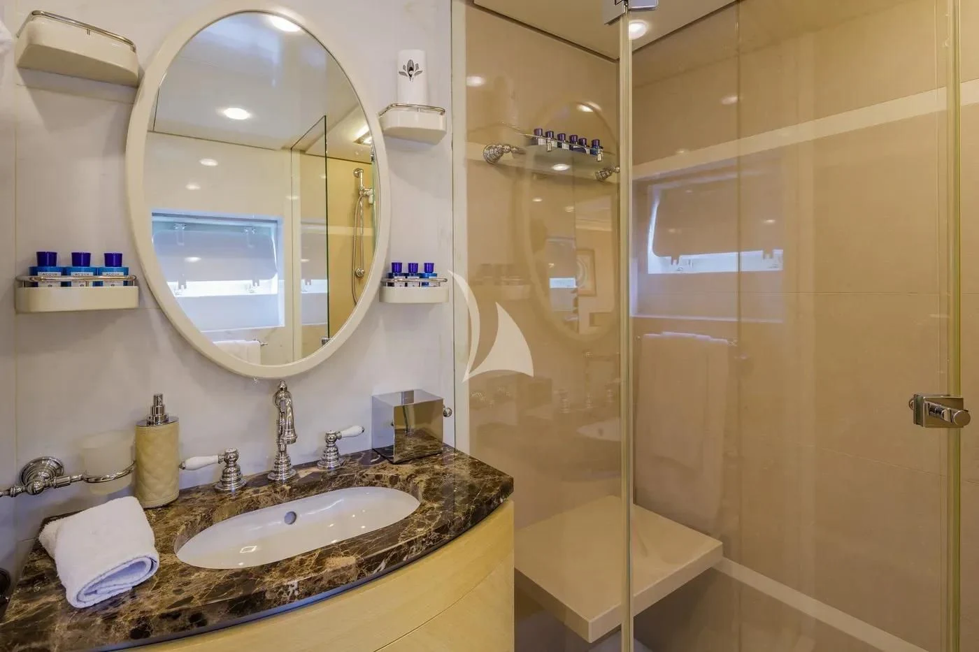 a bathroom with a large mirror aboard ITOTO Yacht for Charter