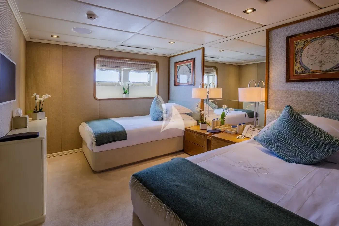 a bedroom with two beds aboard ITOTO Yacht for Charter