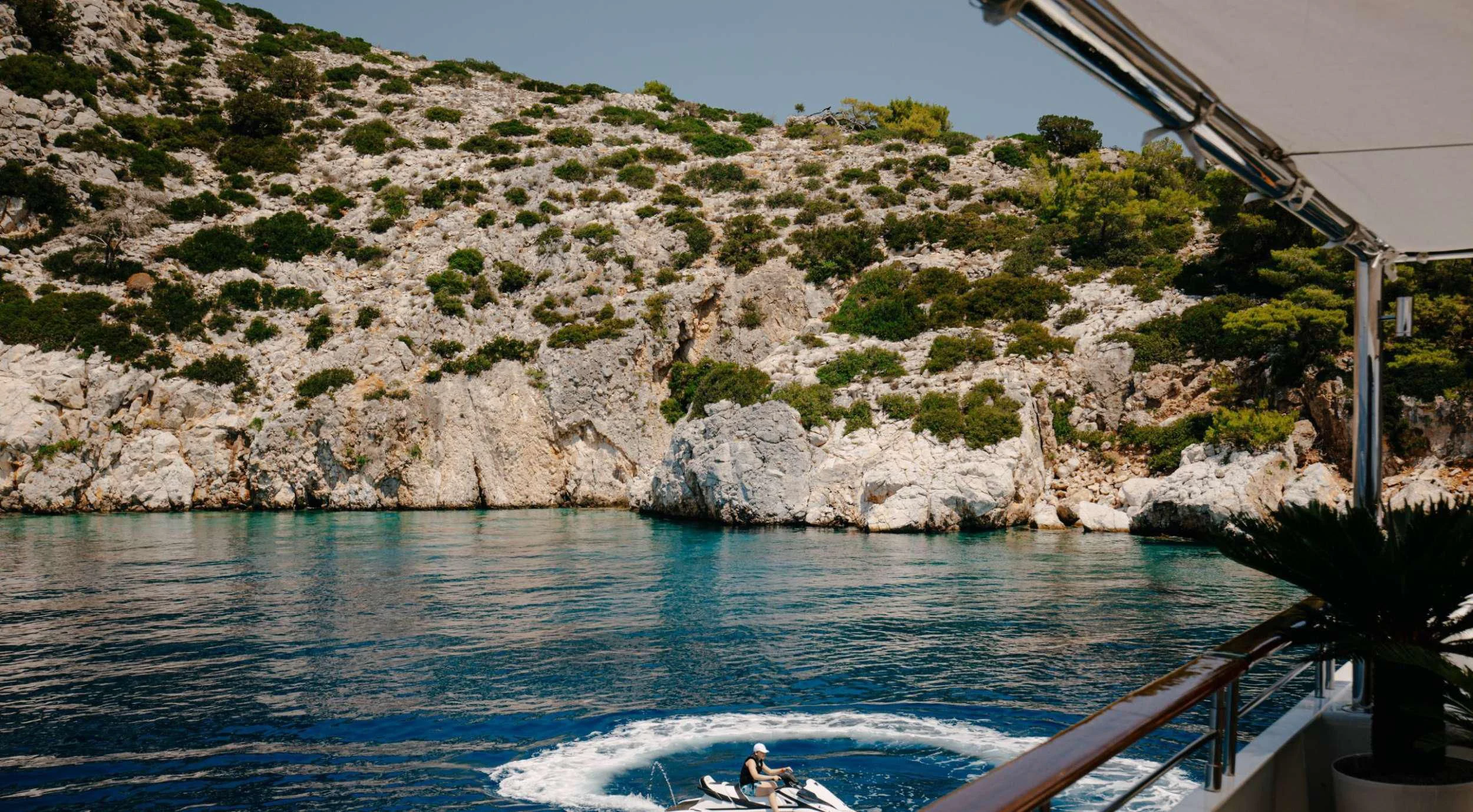 a person on a boat in the water aboard ITOTO Yacht for Charter
