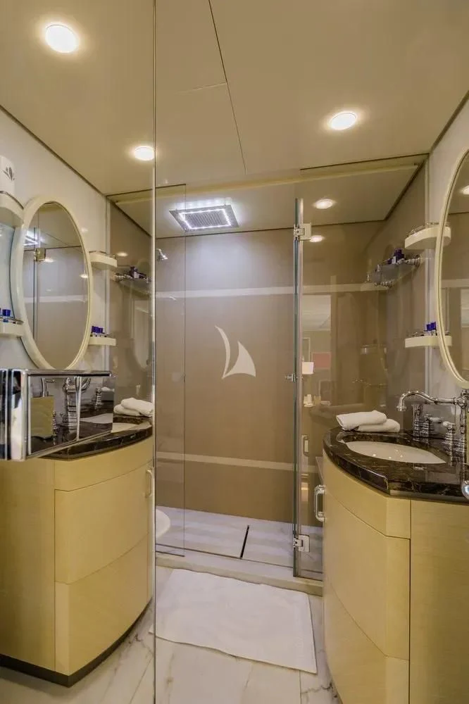 a bathroom with a glass shower aboard ITOTO Yacht for Charter