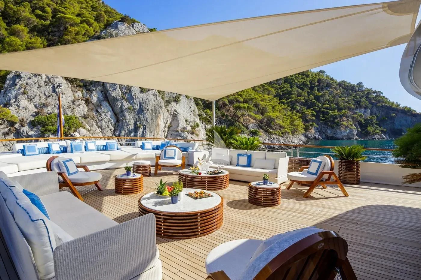 a patio with a table and chairs aboard ITOTO Yacht for Charter
