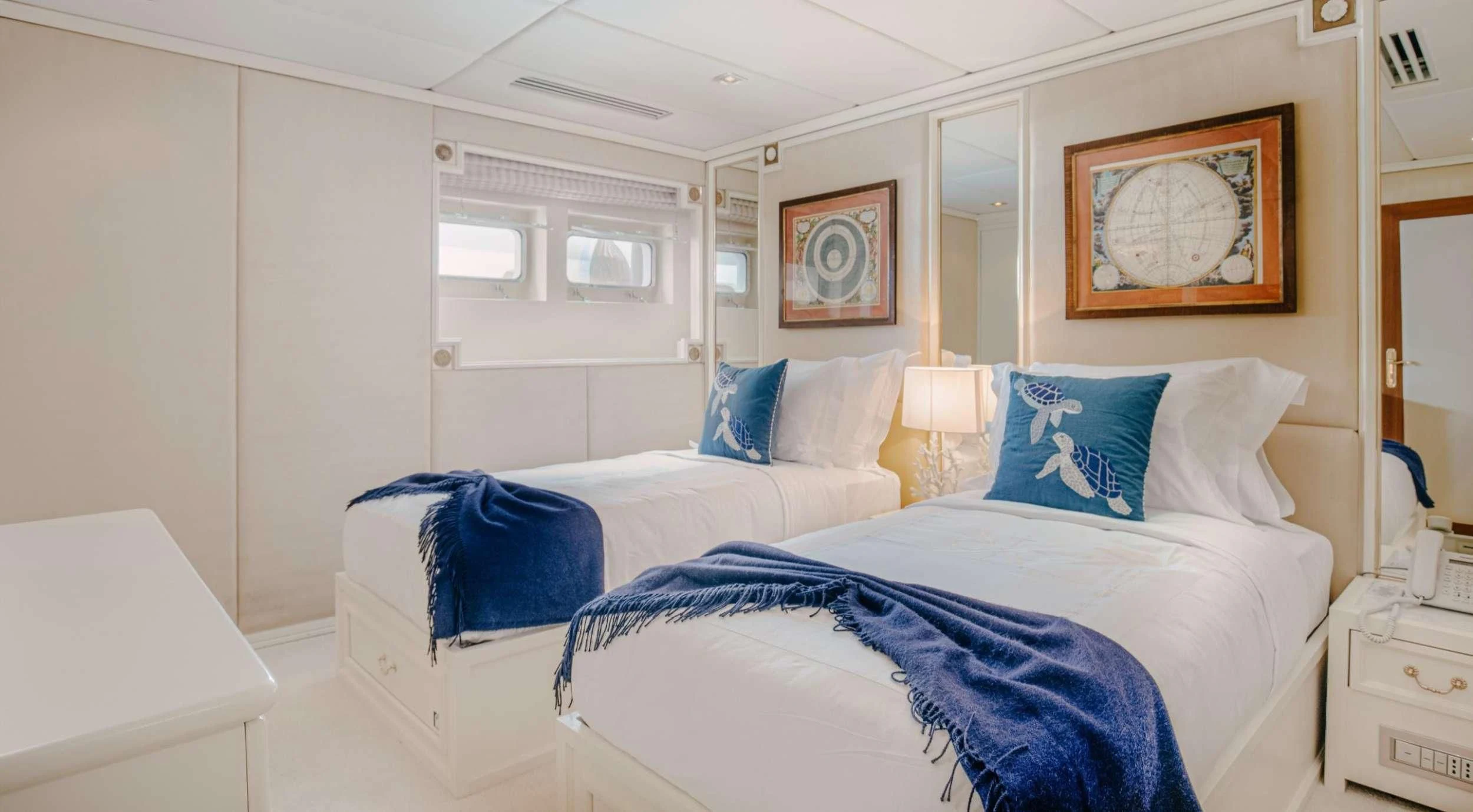 a couple of beds in a room aboard ITOTO Yacht for Charter