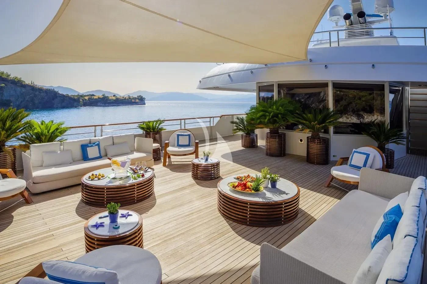 a room with a table and chairs aboard ITOTO Yacht for Charter
