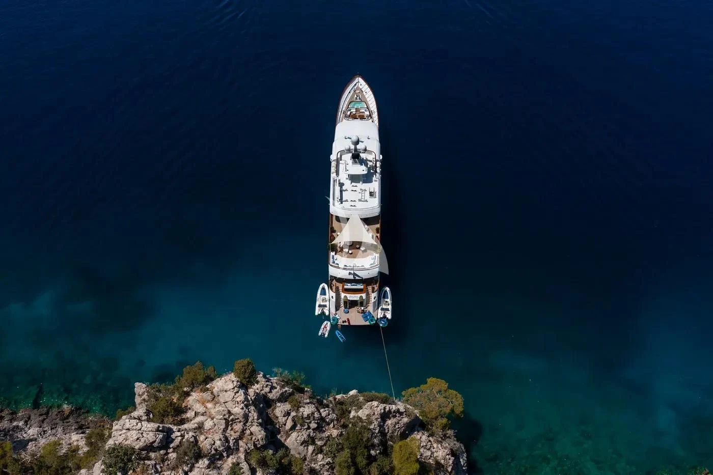 a ship on a rocky shore aboard ITOTO Yacht for Charter