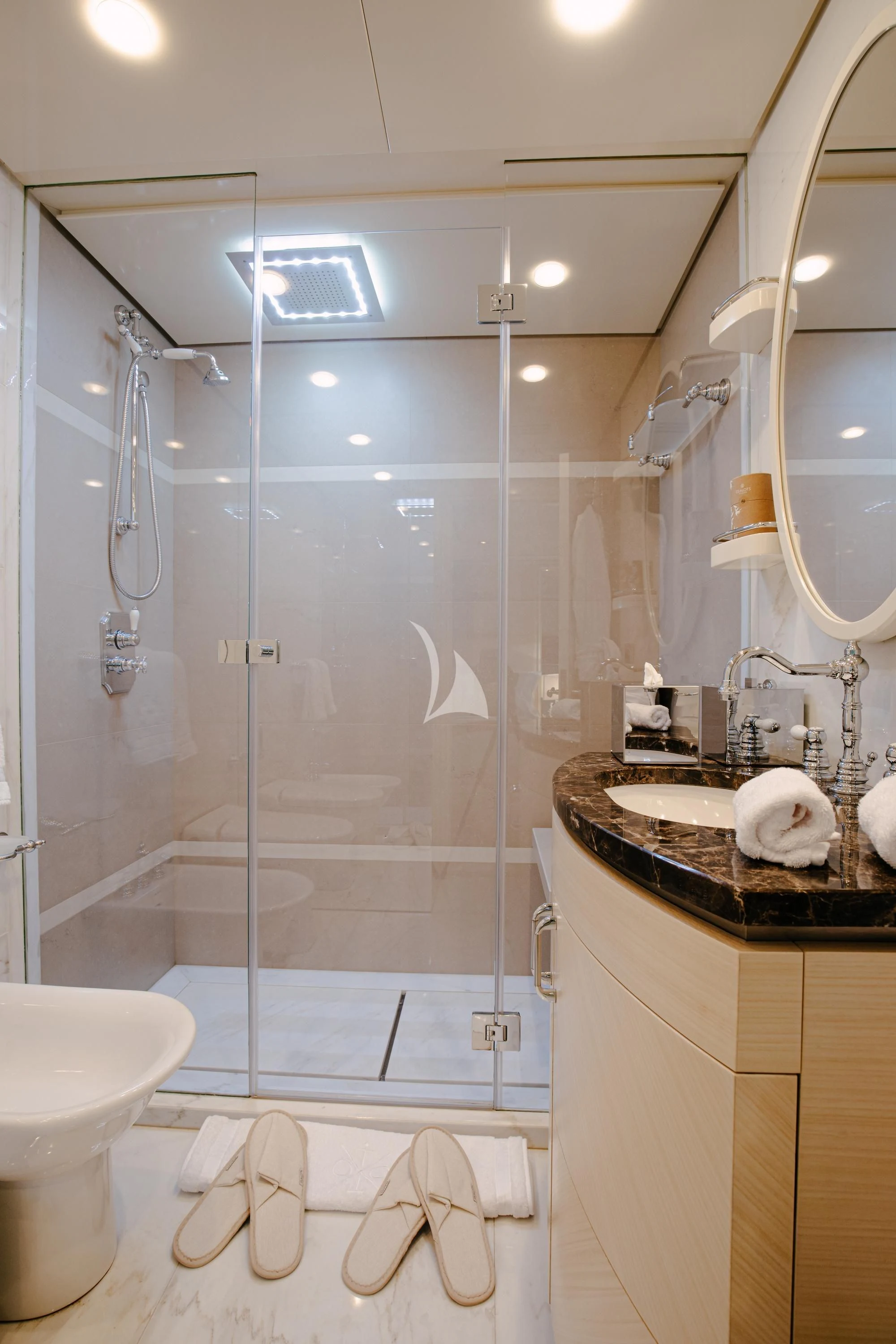a bathroom with a glass shower aboard ITOTO Yacht for Charter
