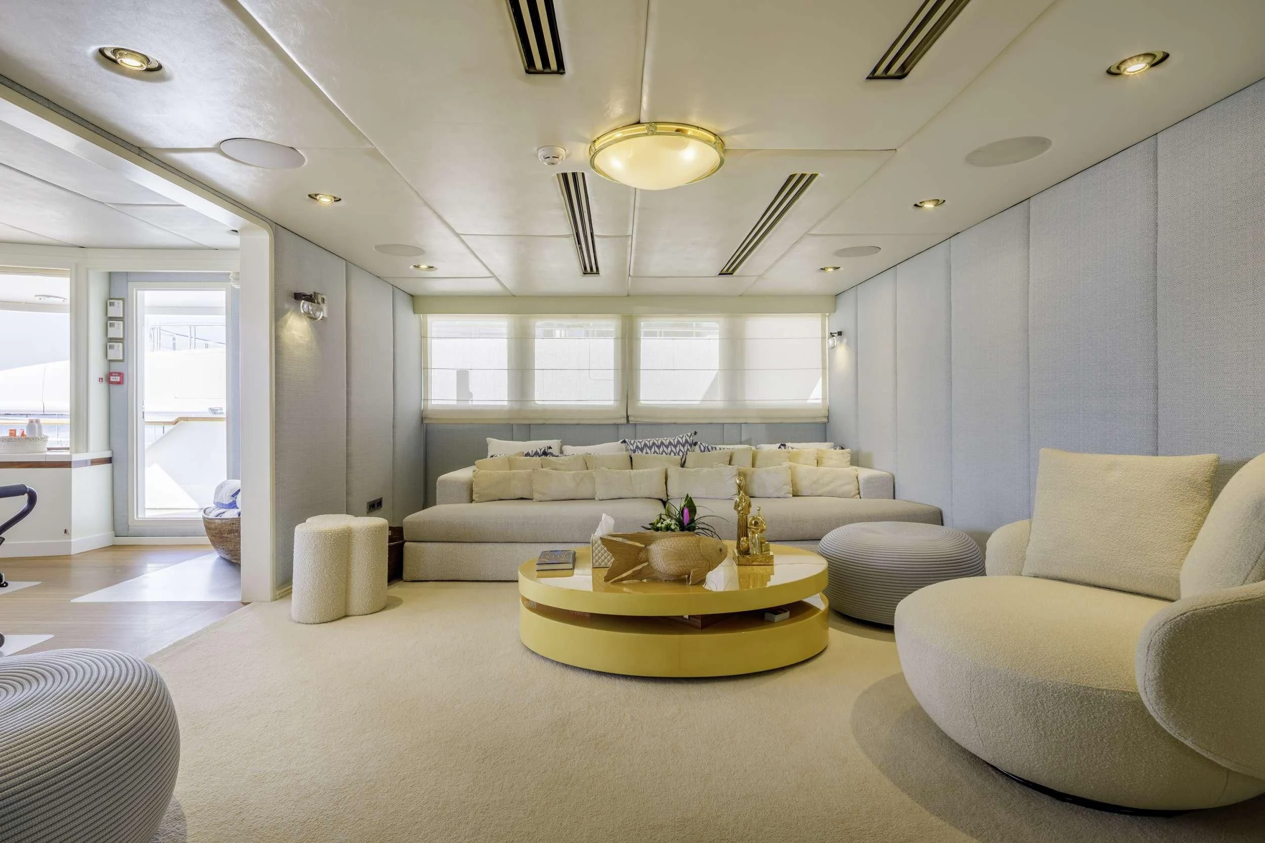 a living room with a large window aboard ITOTO Yacht for Charter