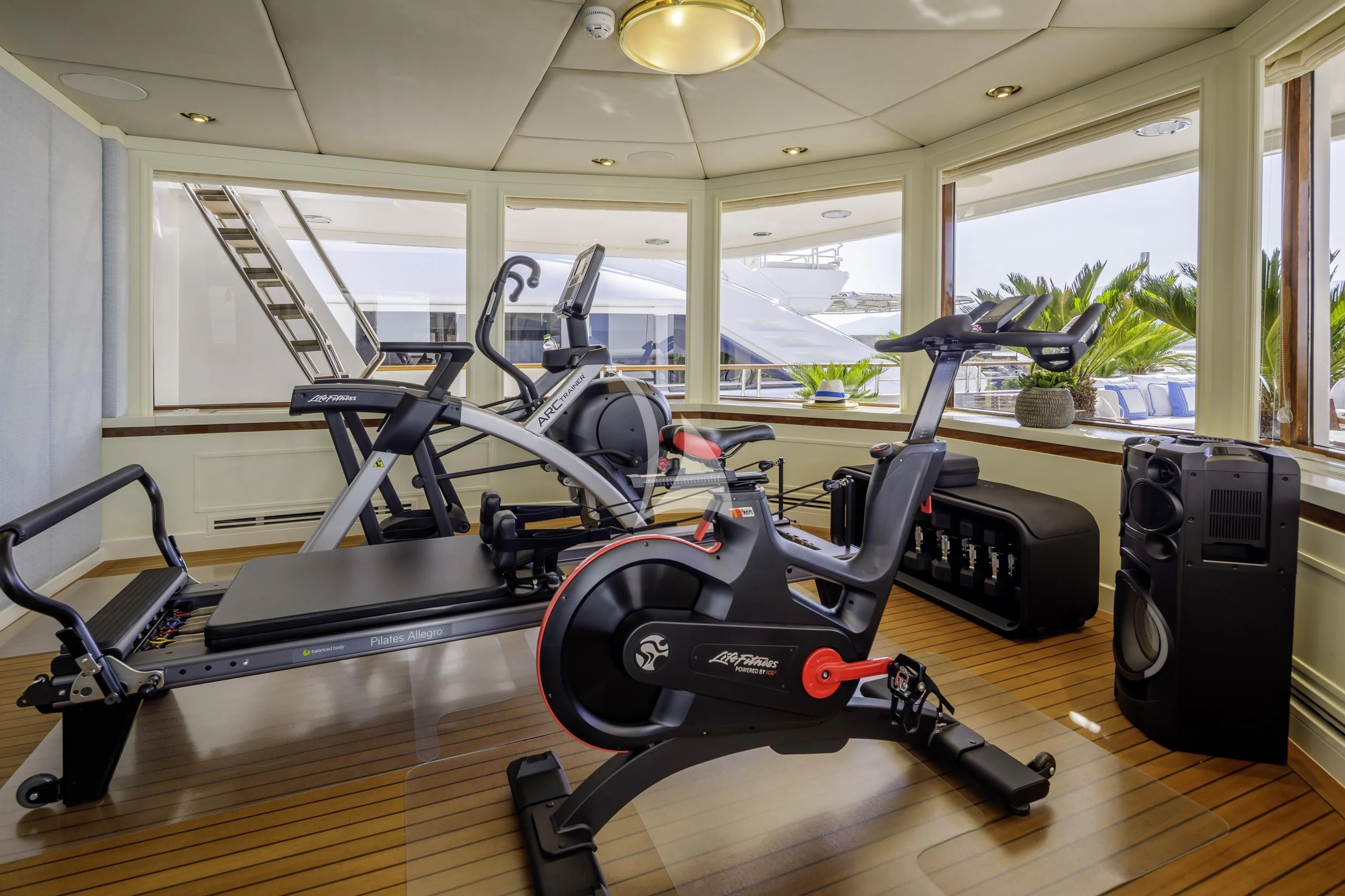 a gym with exercise equipment aboard ITOTO Yacht for Charter
