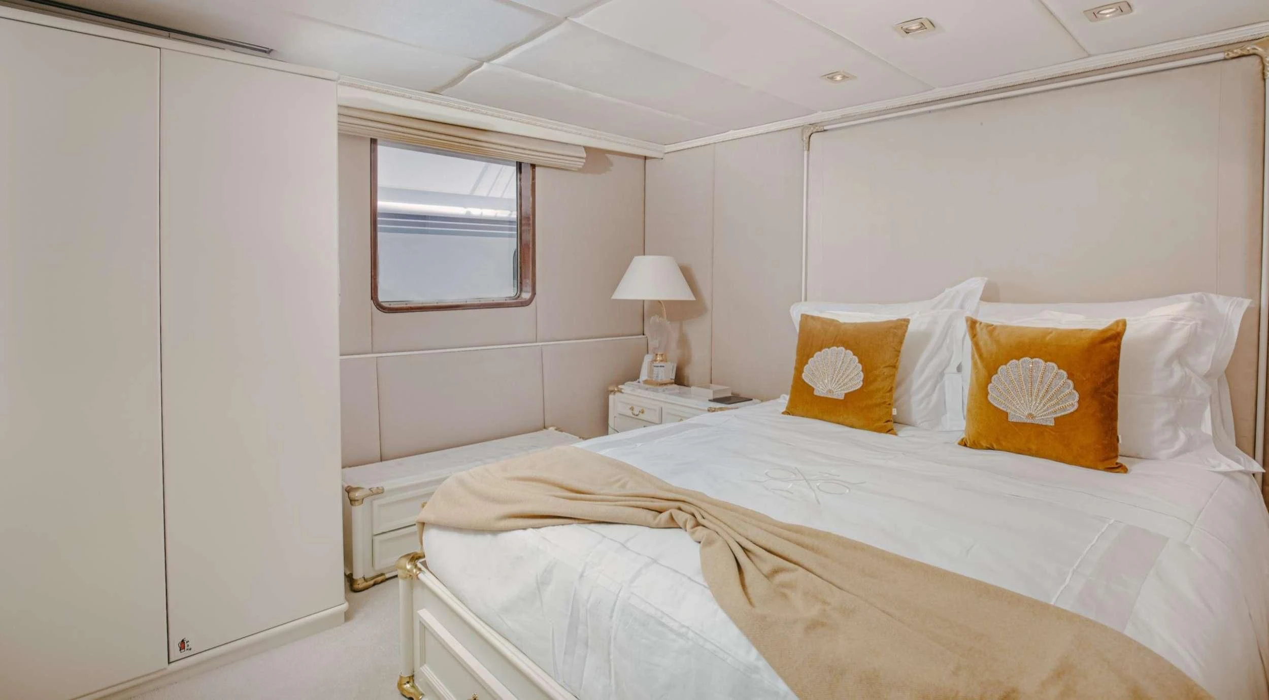 a bed with pillows on it aboard ITOTO Yacht for Charter