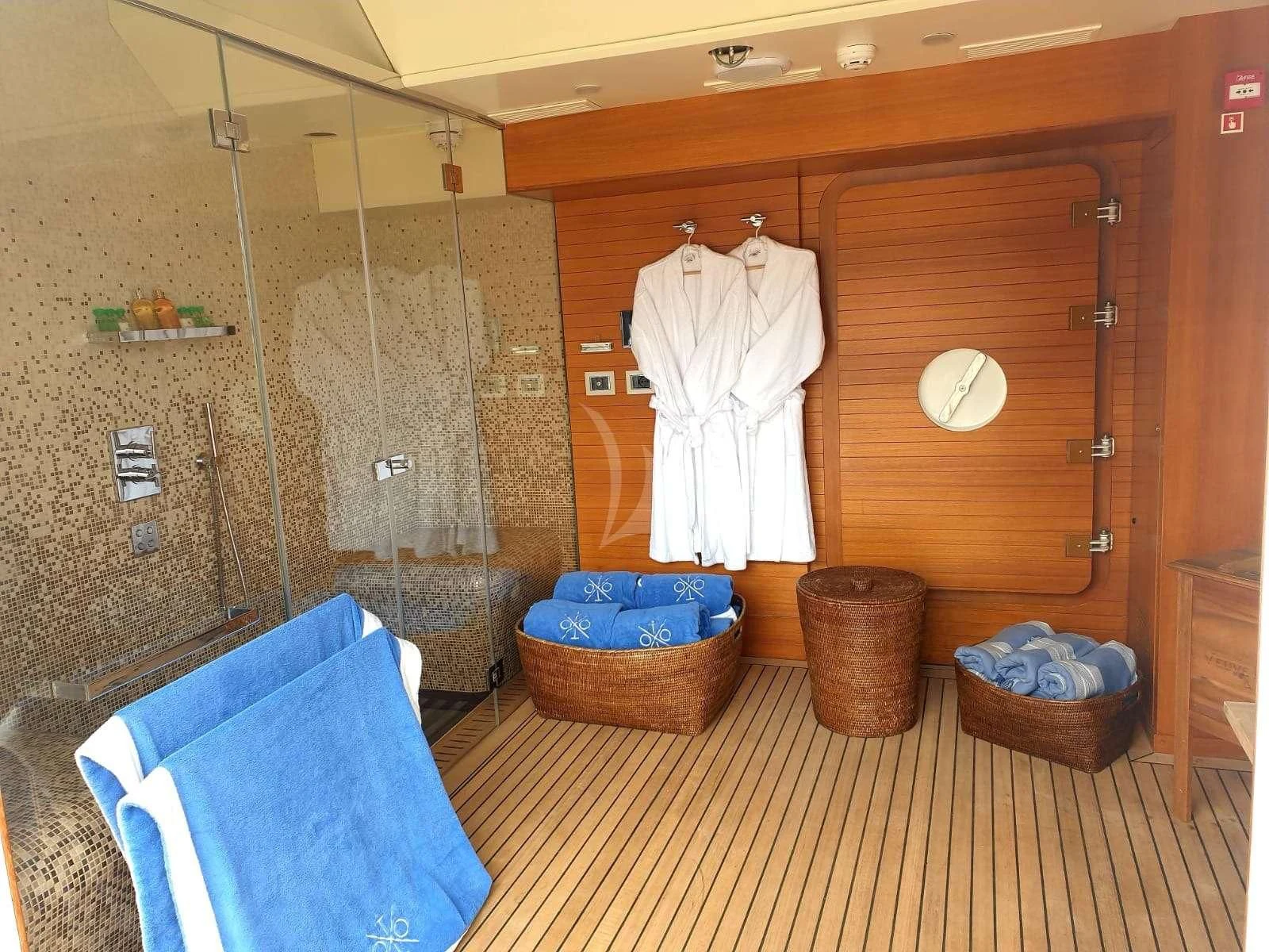 a bathroom with a shower and a sink aboard ITOTO Yacht for Charter