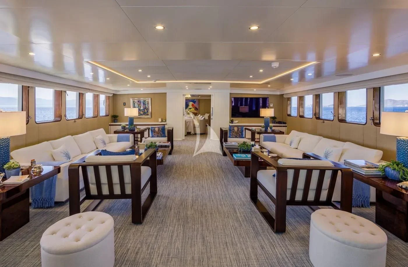 a large living room with a large window aboard ITOTO Yacht for Charter