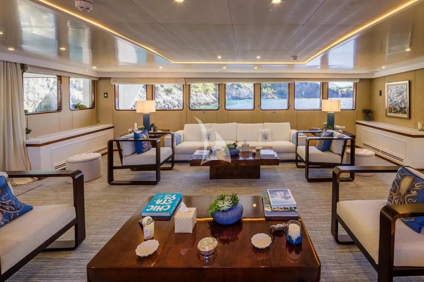 a living room with a table and couches aboard ITOTO Yacht for Charter