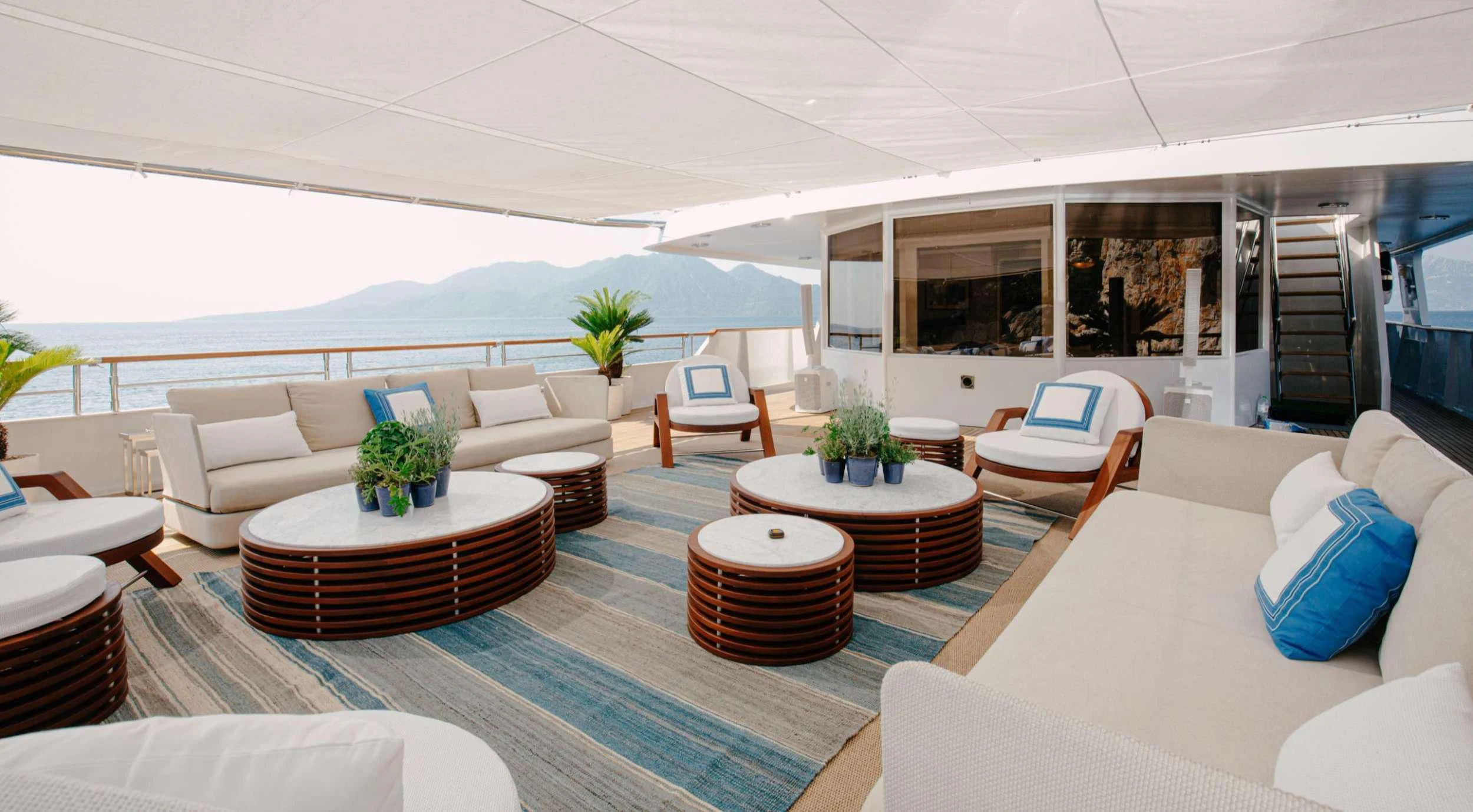 a living room with a table and chairs aboard ITOTO Yacht for Charter