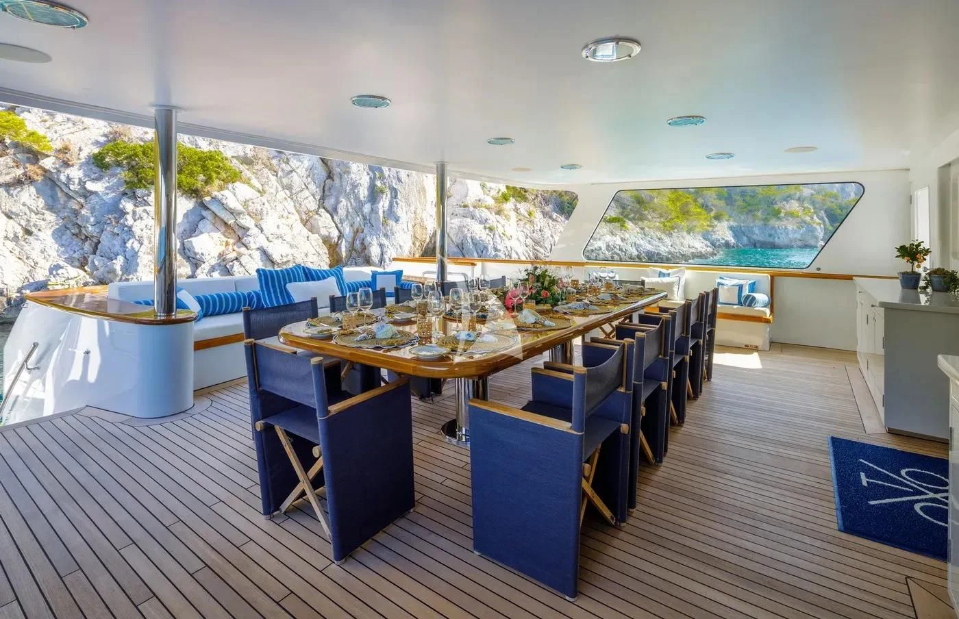 a room with a table and chairs aboard ITOTO Yacht for Charter