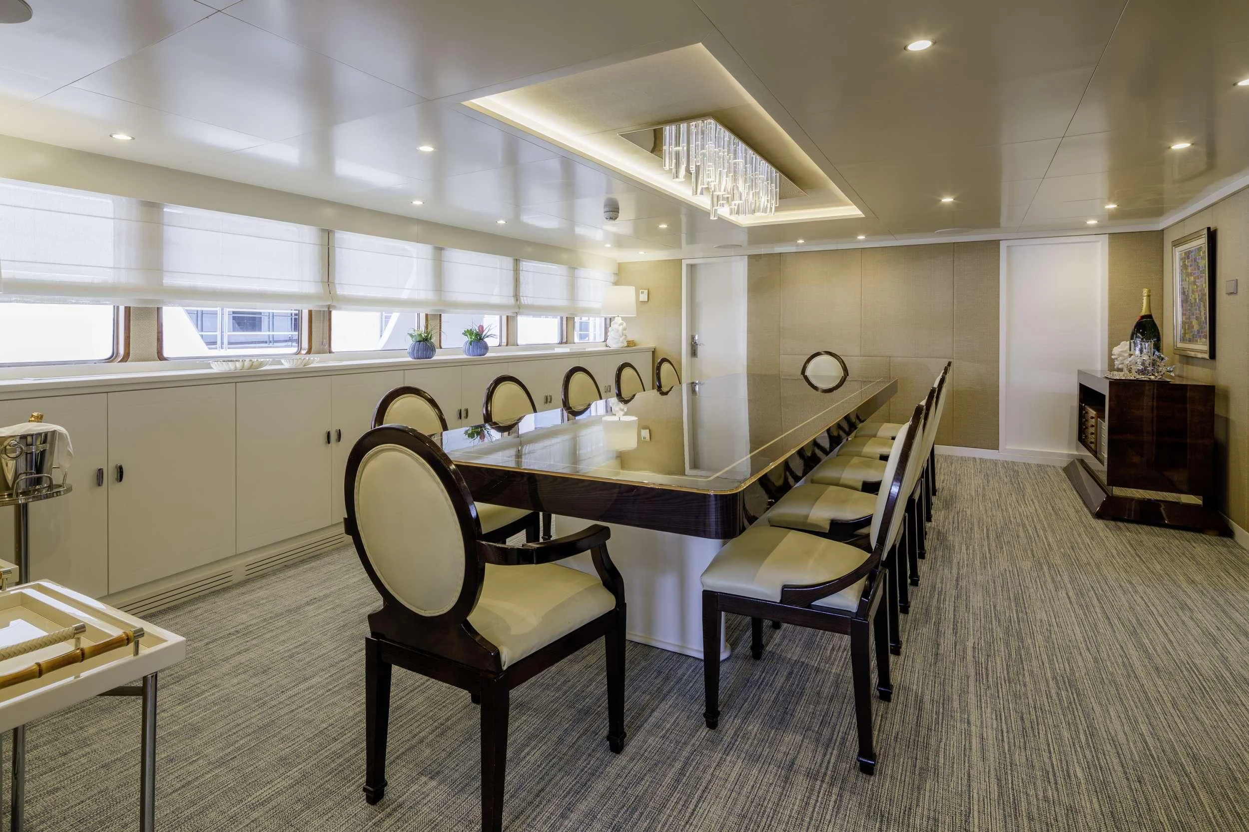 a room with a table and chairs aboard ITOTO Yacht for Charter