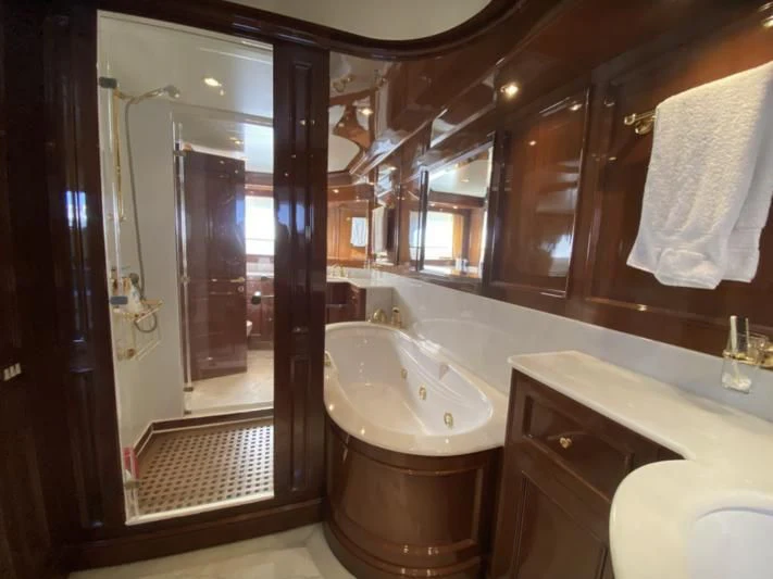 a bathroom with a bathtub and sink aboard GALLUS Yacht for Sale