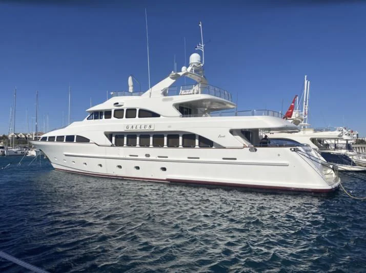 a white yacht in the water aboard GALLUS Yacht for Sale