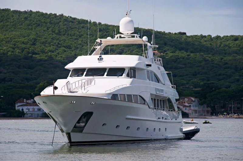 a white yacht in the water aboard GALLUS Yacht for Sale