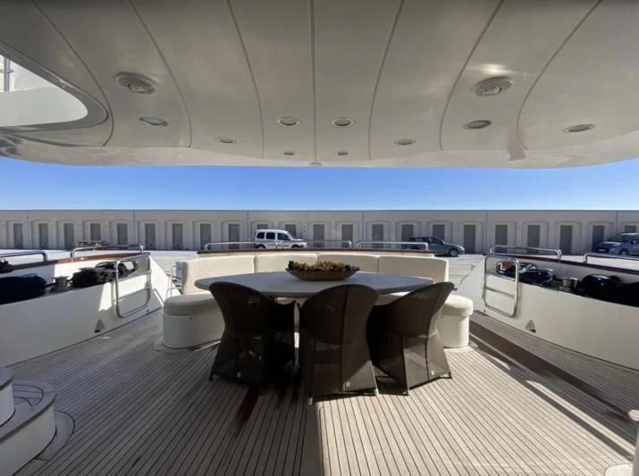 a room with a table and chairs aboard GALLUS Yacht for Sale