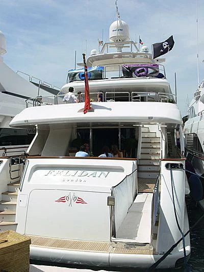 a boat with a flag on the front aboard GALLUS Yacht for Sale