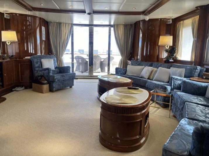 a living room with a large window aboard GALLUS Yacht for Sale