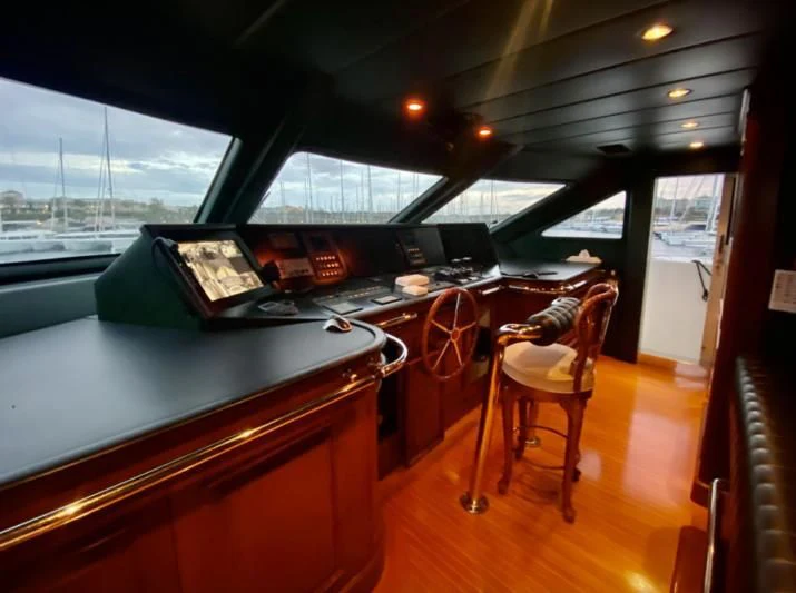 a room with a table and chairs aboard GALLUS Yacht for Sale