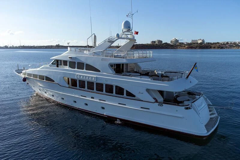 a large white boat on the water aboard GALLUS Yacht for Sale