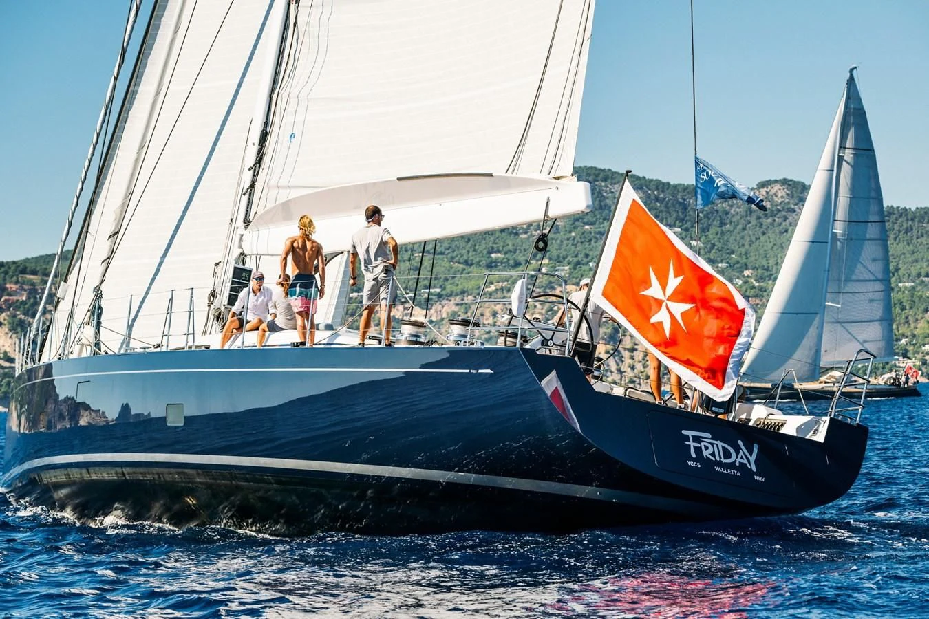 a group of people on a sailboat aboard INTO THE SUNSET Yacht for Sale