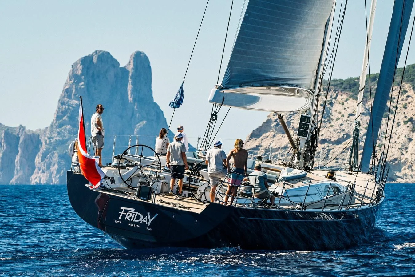 a group of people on a sailboat aboard INTO THE SUNSET Yacht for Sale