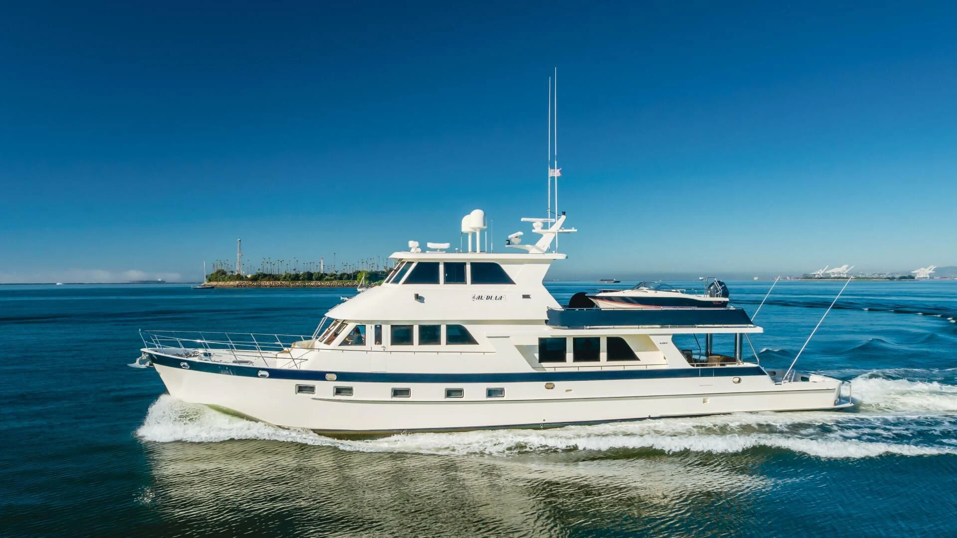 a white yacht on the water aboard AL DI LA Yacht for Sale
