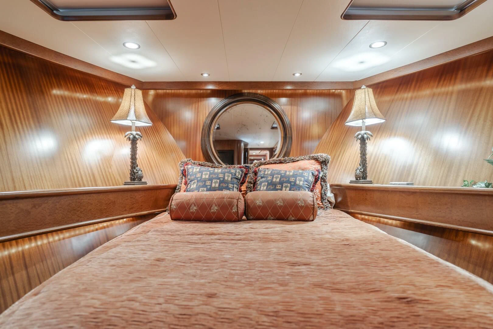 a bed with a brown comforter aboard AL DI LA Yacht for Sale