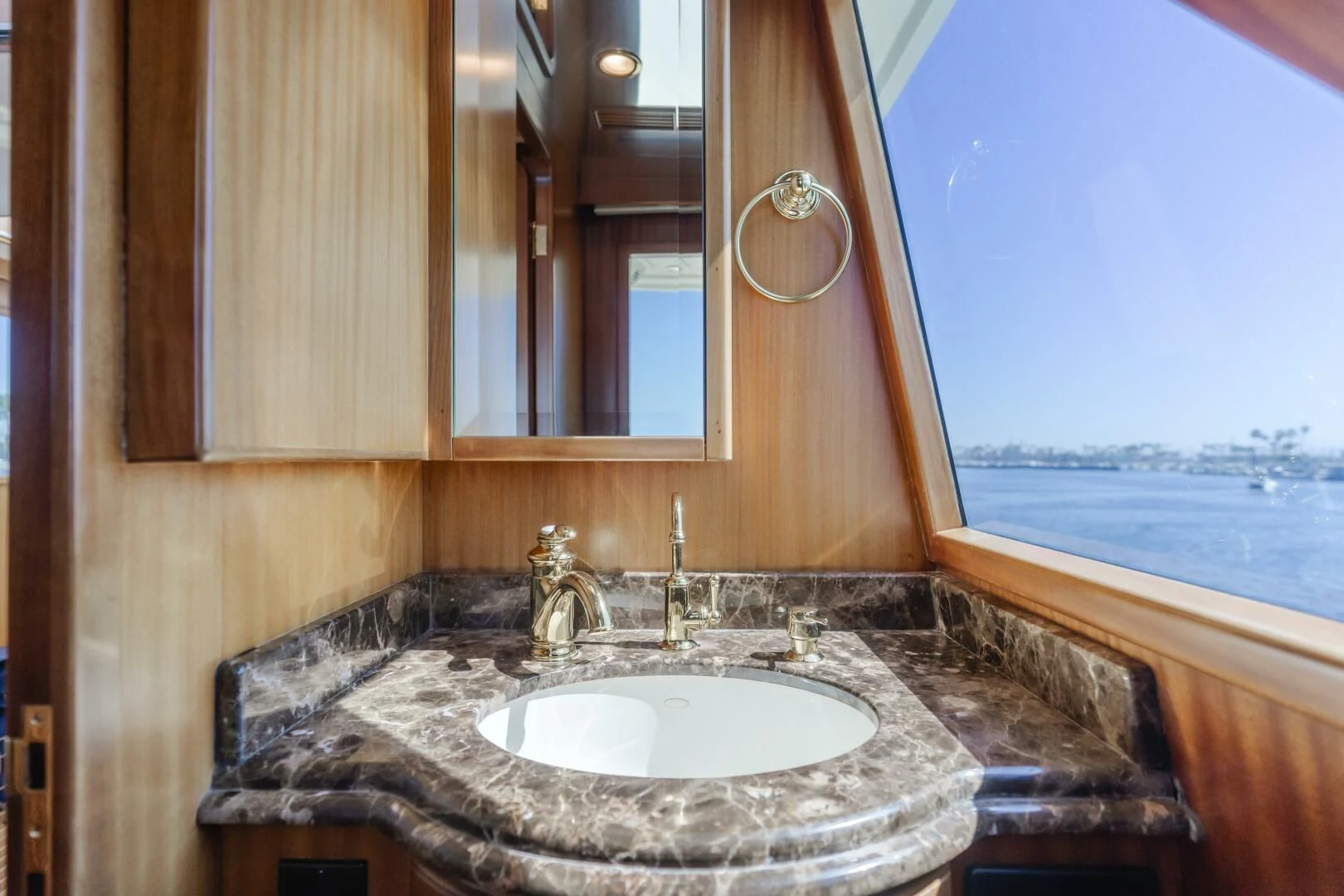 a bathroom with a sink and a large window aboard AL DI LA Yacht for Sale