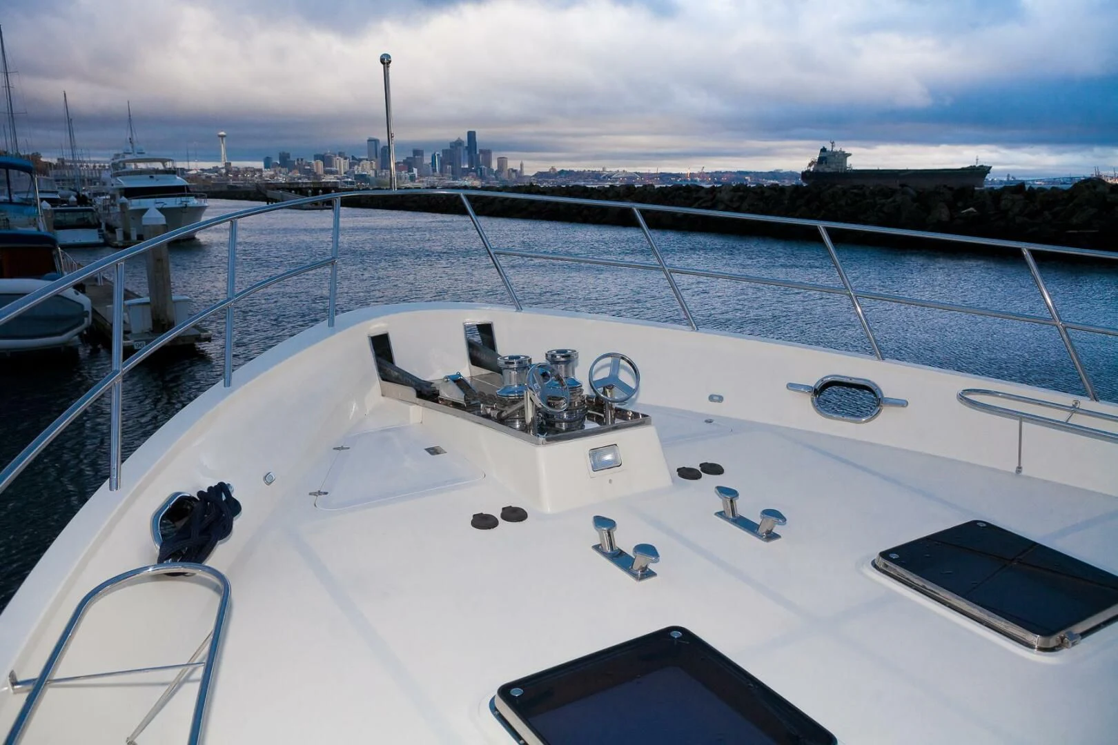 a large white ship in a harbor aboard AL DI LA Yacht for Sale