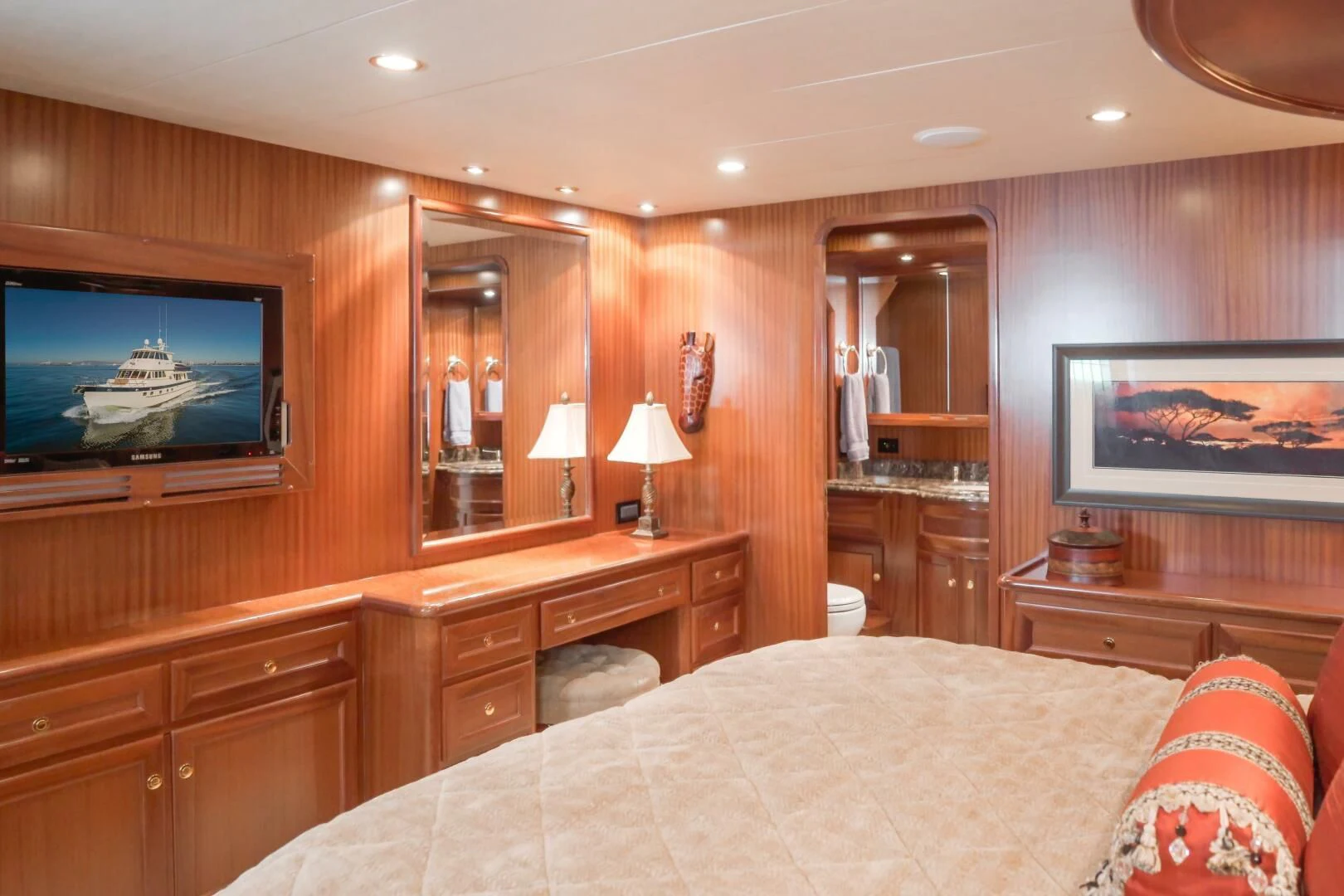 a bedroom with a bed and a television aboard AL DI LA Yacht for Sale