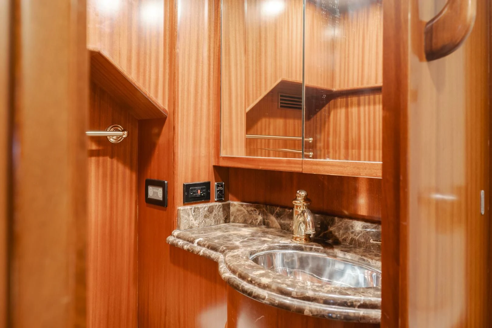 a sink in a wooden bathroom aboard AL DI LA Yacht for Sale