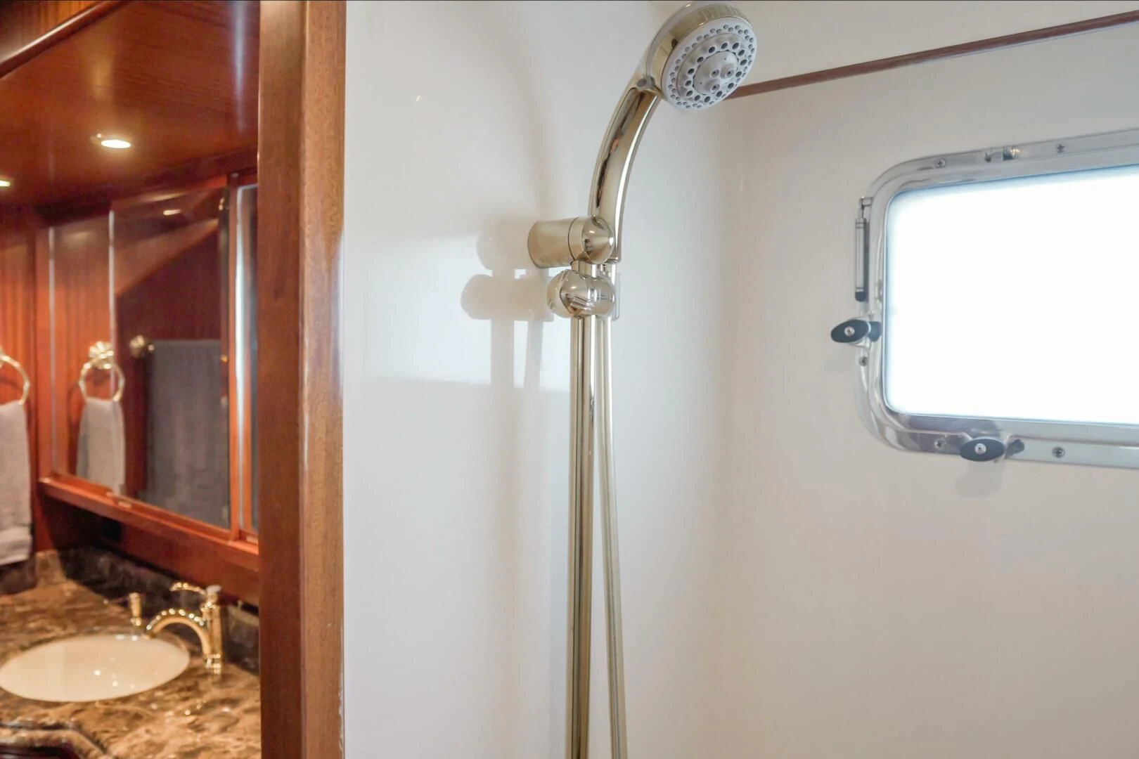a bathroom with a shower head aboard AL DI LA Yacht for Sale